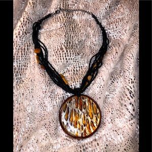 Absolutely Stunning Iridescent animal print large pendant black bead necklace!